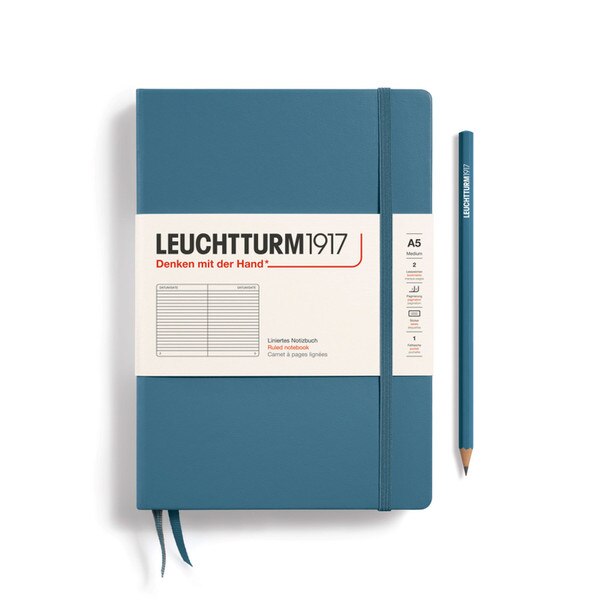 A stone colored hardcover notebook.